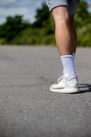 A Nineteen Year Old Teenage Boy Jogging In A Public Park
