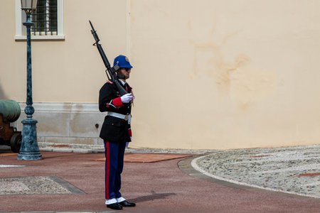 Monte-Ville, Monaco, April 21st 2023:- A member of the Compagnie des Carabiniers du Prince marching outside the Palace in Monacoのeditorial素材
