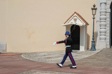 Monte-Ville, Monaco, April 21st 2023:- A member of the Compagnie des Carabiniers du Prince marching outside the Palace in Monacoのeditorial素材