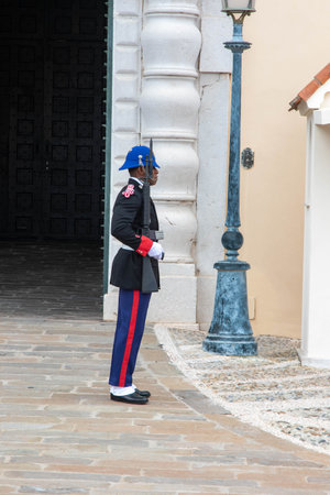 Monte-Ville, Monaco, April 21st 2023:- A member of the Compagnie des Carabiniers du Prince standing sentry outside the Palace in Monacoのeditorial素材