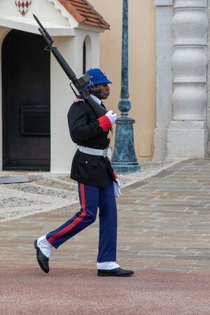 Monte-Ville, Monaco, April 21st 2023:- A member of the Compagnie des Carabiniers du Prince standing sentry outside the Palace in Monacoのeditorial素材