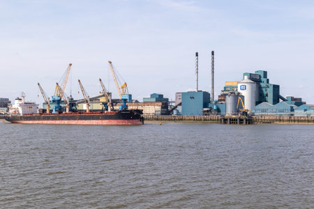 London, United Kingdom, May 28th 20203:- A view of the Tate & Lyle Sugar Factory in East London from across the River Thamesのeditorial素材