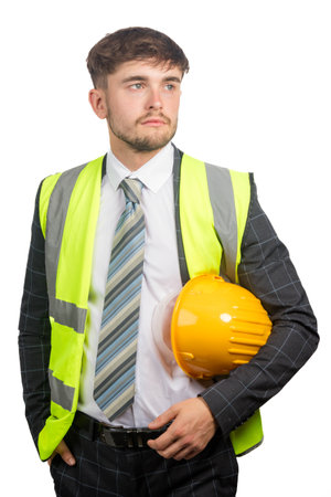 Portrait of a business man in a suit, with a hi-vis vest holding a hardhatの写真素材