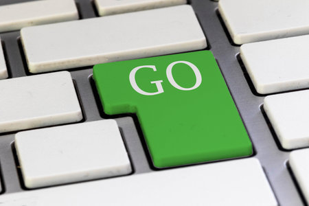 A Green key on a computer keyboard reading GO in capital lettersの写真素材