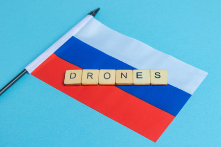 The National Flag of The Russian Federation, along with a sign reading Dronesの写真素材
