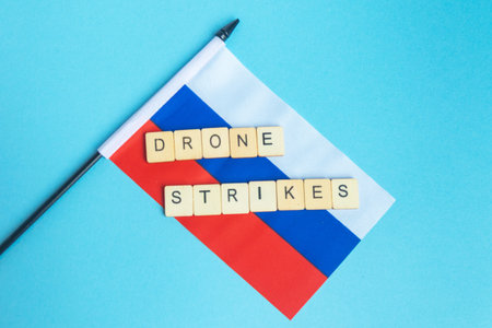 The National Flag of The Russian Federation, along with a sign reading Drone Strikesの写真素材