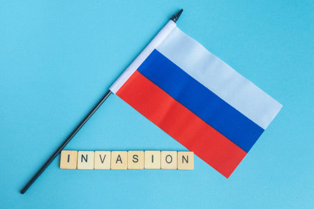 The National Flag of The Russian Federation, along with a sign reading Invasionの写真素材