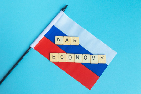 The National Flag of The Russian Federation, along with a sign reading War Economyの写真素材