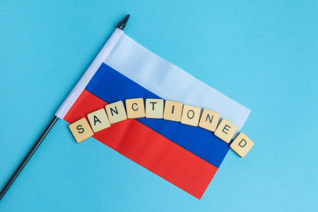 The National Flag of The Russian Federation, along with a sign reading Sanctionedの写真素材