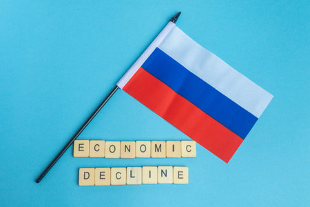 The National Flag of The Russian Federation, along with a sign reading Economic Declineの写真素材