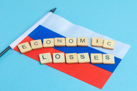 The National Flag of The Russian Federation, along with a sign reading Economic Losses