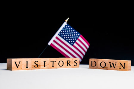 United States of America Concept, with selective focus on the US flag along with a sign reading Visitors Downの写真素材