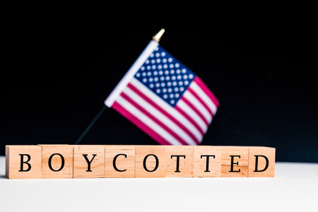 United States of America Concept, with selective focus on the US flag along with a sign reading Boycottedの写真素材