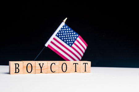 United States of America Concept, with selective focus on the US flag along with a sign reading Boycottの写真素材