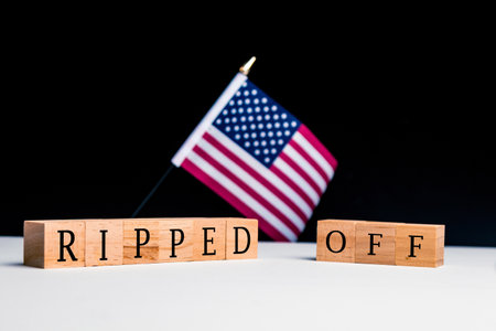 United States of America Concept, with selective focus on the US flag along with a sign reading Ripped Offの写真素材