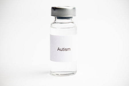 Vaccine concept, a medical vial with a label reading on a plain white background.