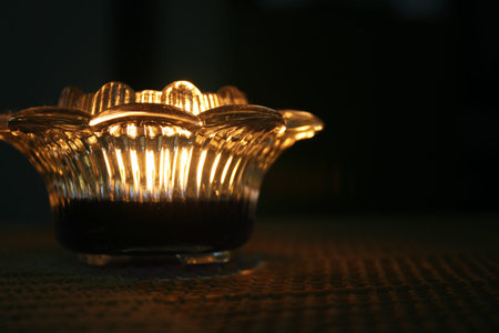 Candle Light with a lotus holder in a dark room 