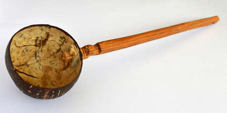 Horizontal image of a coconut dipper in front of a white backgroundの写真素材