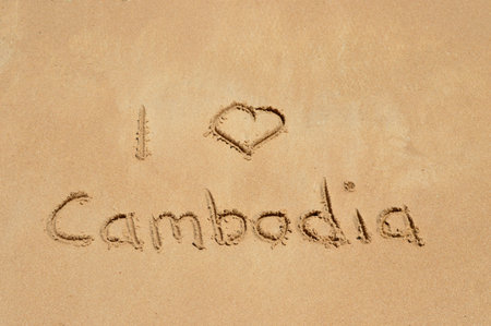 The text 'I love Cambodia' written in the sand at a tropical beachの写真素材