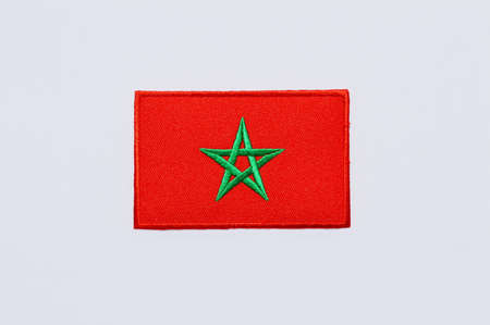 A clothes patch of the moroccan flag on white backgroundの写真素材