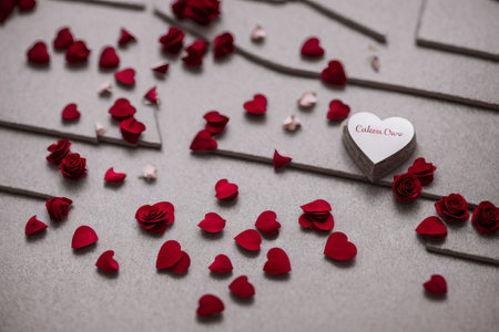 Valentine's day background with red hearts and rose petalsの素材