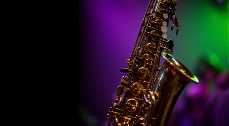 Close-up of a gleaming saxophone with colorful stage lights. That the image is generated using AI.の素材