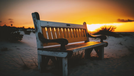 Wooden bench on the beach at sunset. Selective focus.の素材