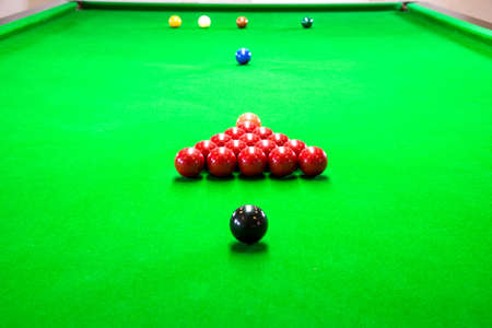 a photo of a snooker game that is setting up before start the gameの写真素材