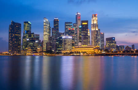 a photo of singapore skyline in a twilight blue skyのeditorial素材