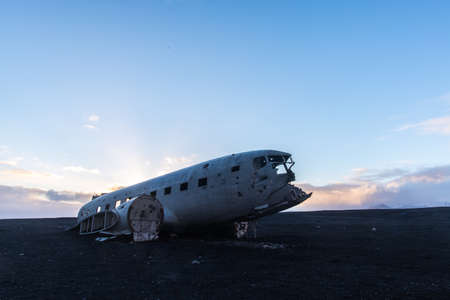 Plane crash wreckage on black sand in Icelandの写真素材
