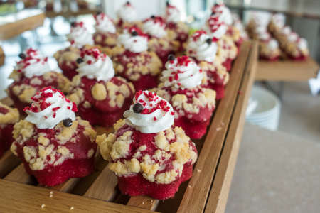 This is a photo of berry muffin on the wooden trayの写真素材