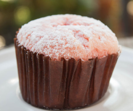 Chiffon strawberry cupcakes on  white dishの写真素材