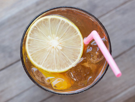 Tea with lemon in a glass of cold