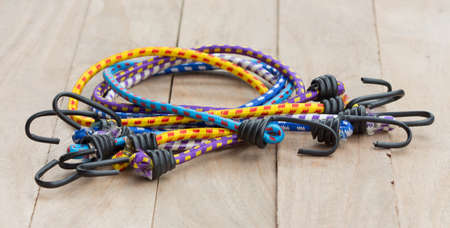 Elastic Band on the old wooden floor.の写真素材