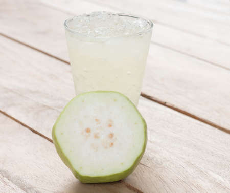 Guava juice  on the wooden floor.の写真素材