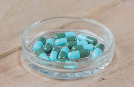 Medicine capsules on the glass