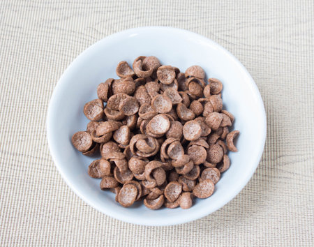 Cocoa cereal in white bowl.