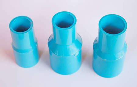 Blue pvc plumbing fittings on  white background.の写真素材