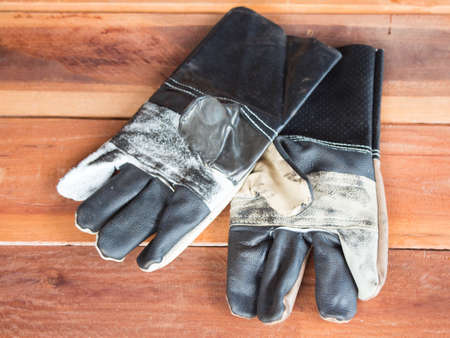 Construction glove on the wooden floorの写真素材