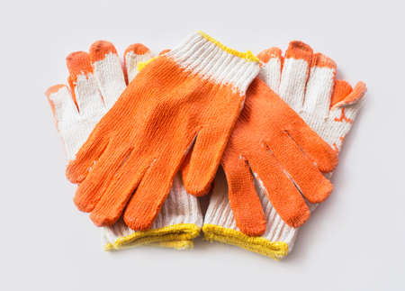 Dirty used fabric glove on white backgrounds.の写真素材
