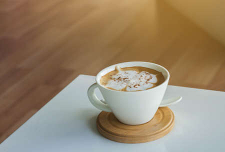 Cup of hot coffee on a white table.の写真素材
