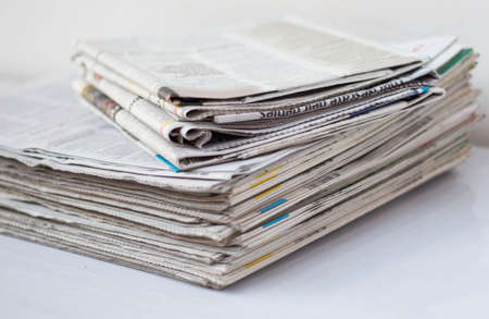 Newspapers on white table.の写真素材