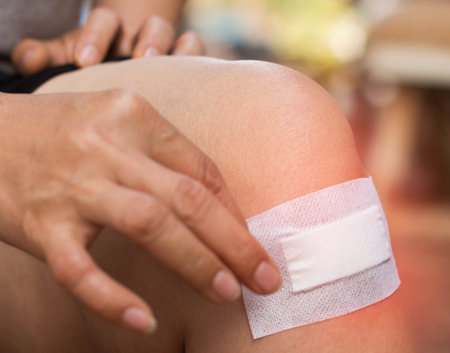 Sticking plaster on the knee.