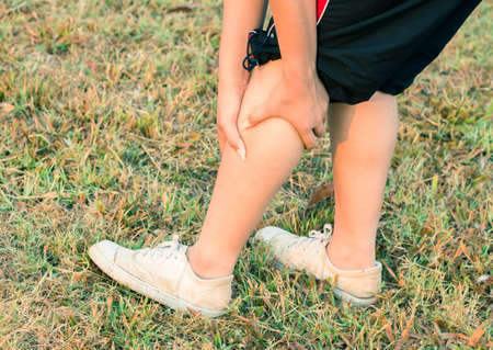 Woman leg calf massage for pain relief.の写真素材