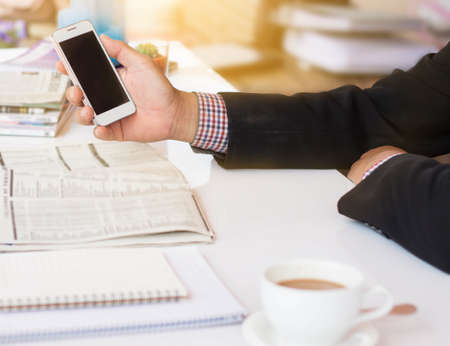 businessman looking at the phone.の写真素材