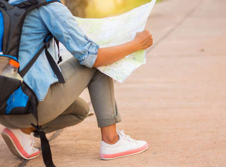 woman traveling with vintage backpack.の写真素材