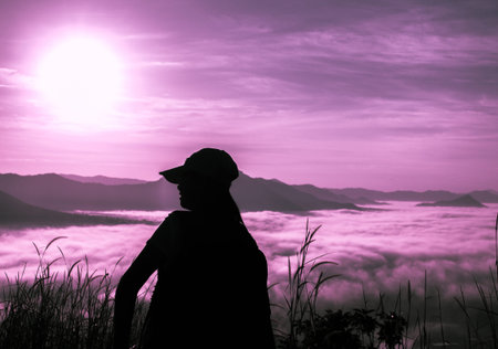 Women are happy looking at the landscape with fog at mountains. with sunrise.