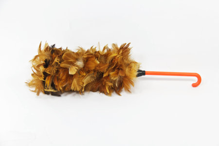 Soft duster with plastic handle on white background