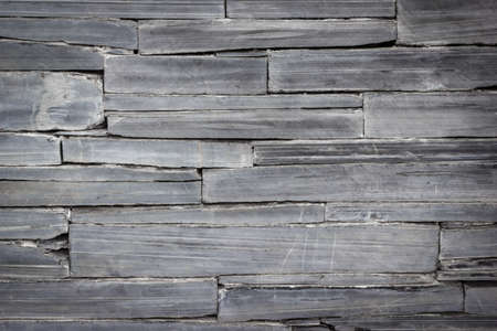 pattern of modern brick wall, slate stone wall surface and background textureの写真素材