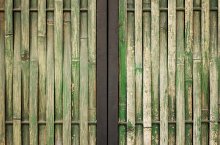 Walls green bamboo damaged painted with steel frame background, Walls bamboo with steel frameの写真素材